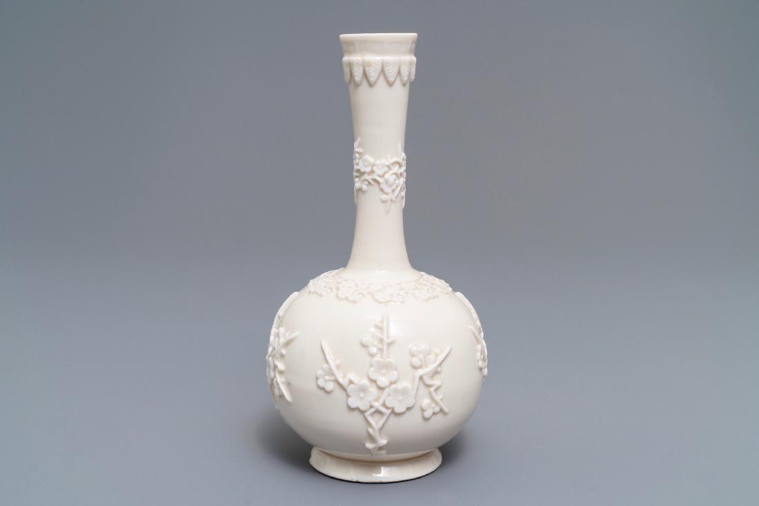 A Chinese Dehua blanc de Chine vase with applied floral: A Chinese Dehua blanc de Chine vase with applied floral designs, Kangxi ----- H.: 23 cm See also: Sotheby's, London, Nov. 7, 2012, lot 13, for a nearly identical example. (sold GBP 6.875) (link)