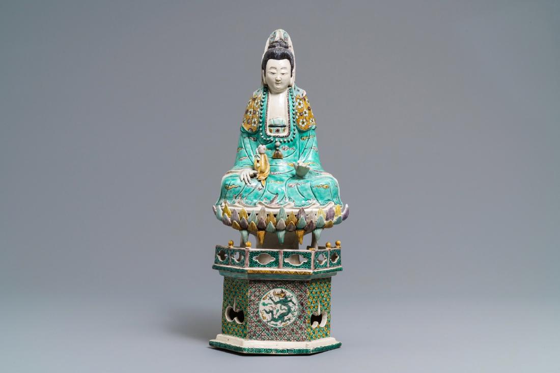 A Chinese verte biscuit group of Guanyin with child on: A Chinese verte biscuit group of Guanyin with child on a lotus throne, Kangxi ----- H.: 42 cm
