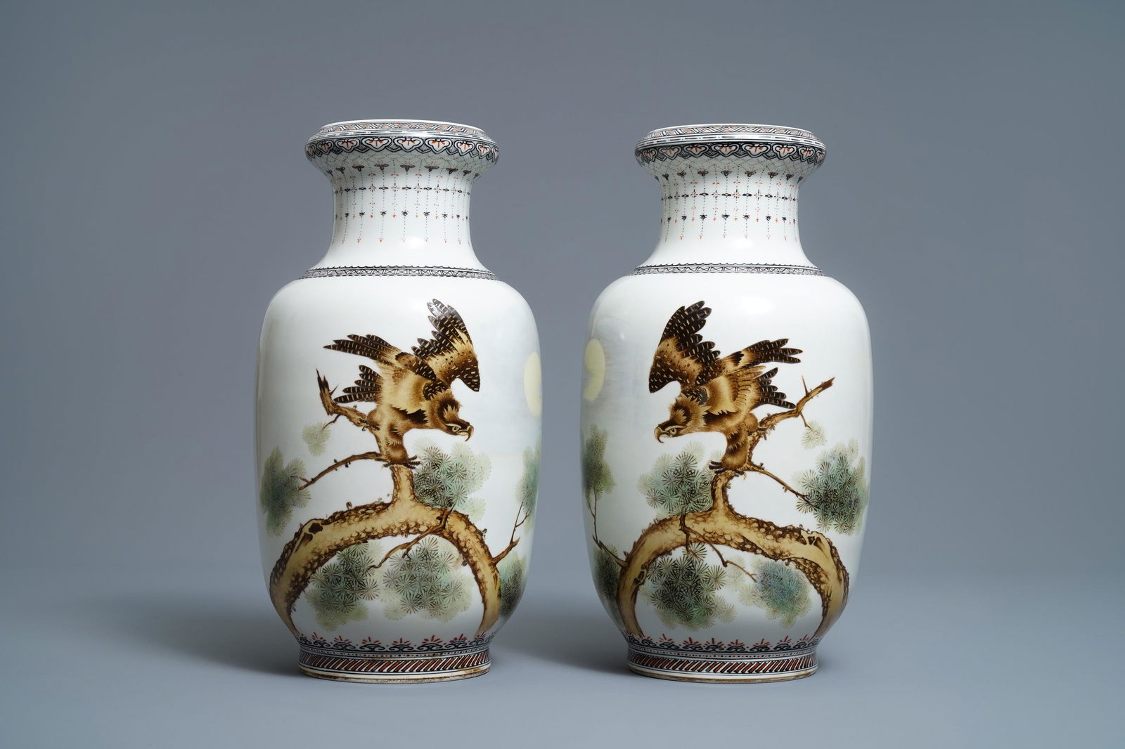 A pair of Chinese polychrome vases with birds of prey,: A pair of Chinese polychrome vases with birds of prey, signed Cheng Yiting (1885-1948), dated 1931 -- H.: 37 cm