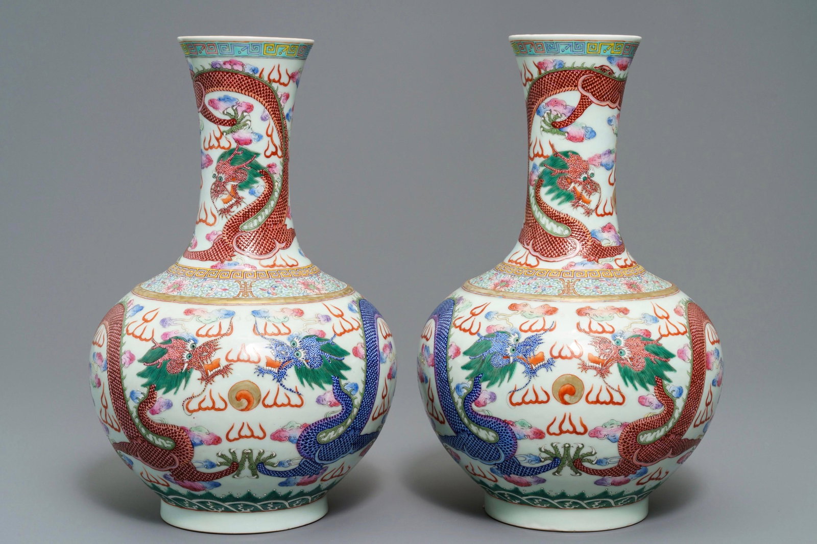 A pair of Chinese famille rose 'dragon' vases, Guangxu: A pair of Chinese famille rose 'dragon' vases, Guangxu mark and of the period -- H.: 38,5 cmÂ Condition: (UV-checked) - Both in excellent condition.