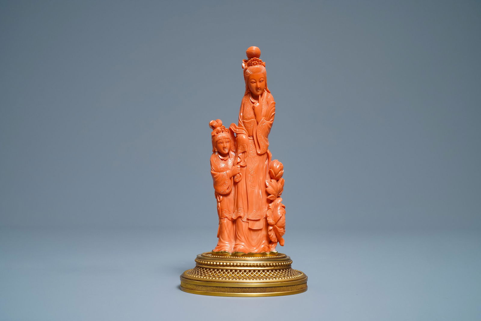 A Chinese carved red coral group of a lady and a girl,: A Chinese carved red coral group of a lady and a girl, 19/20th C. -- H.: 22 cm (incl. stand)Â Weight: 763 gr.