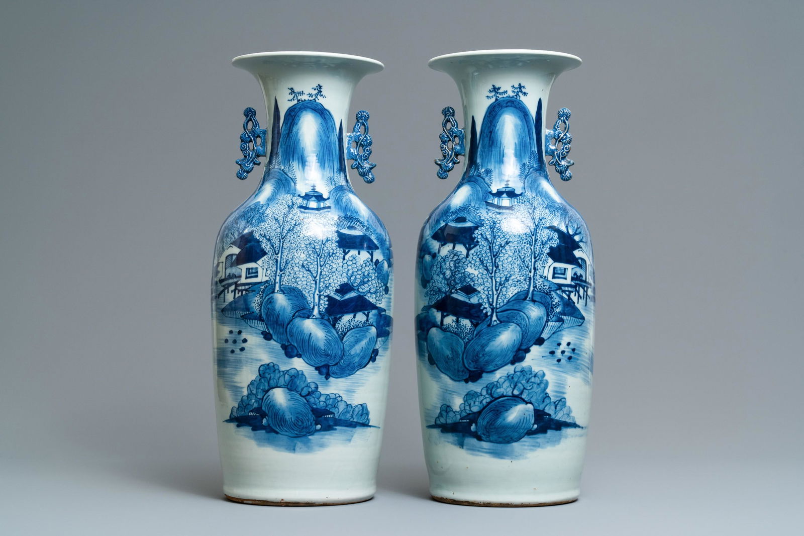 A pair of Chinese blue and white 'landscape' vases,: A pair of Chinese blue and white 'landscape' vases, 19th C. H.: 58 cm