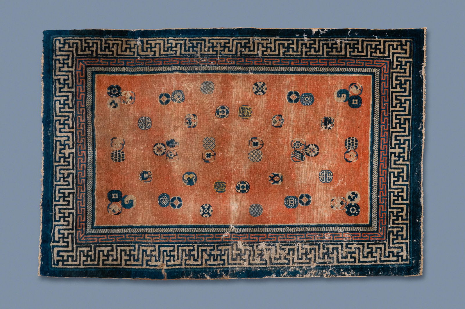 A rectangular Chinese hand-knotted wool carpet with: A rectangular Chinese hand-knotted wool carpet with brocade balls, 19th C. Dim.: 200 x 135 cm