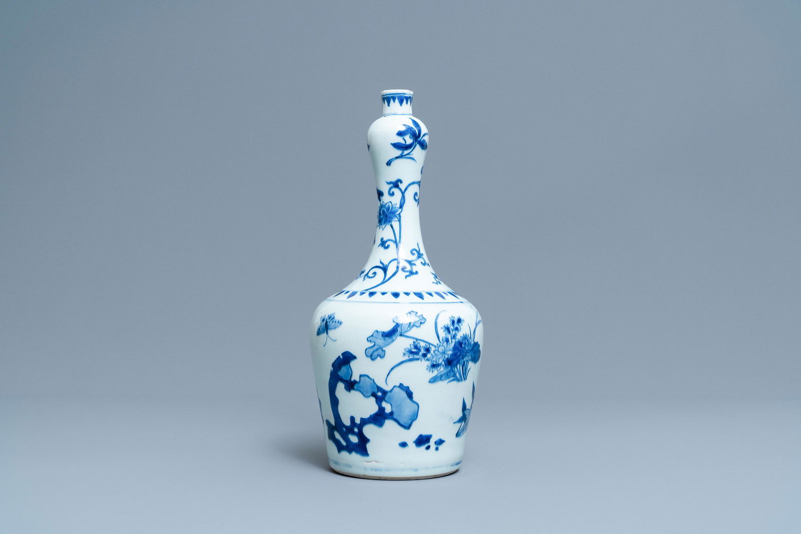 A Chinese blue and white bottle vase with floral: A Chinese blue and white bottle vase with floral design, Transitional period H.: 37 cm