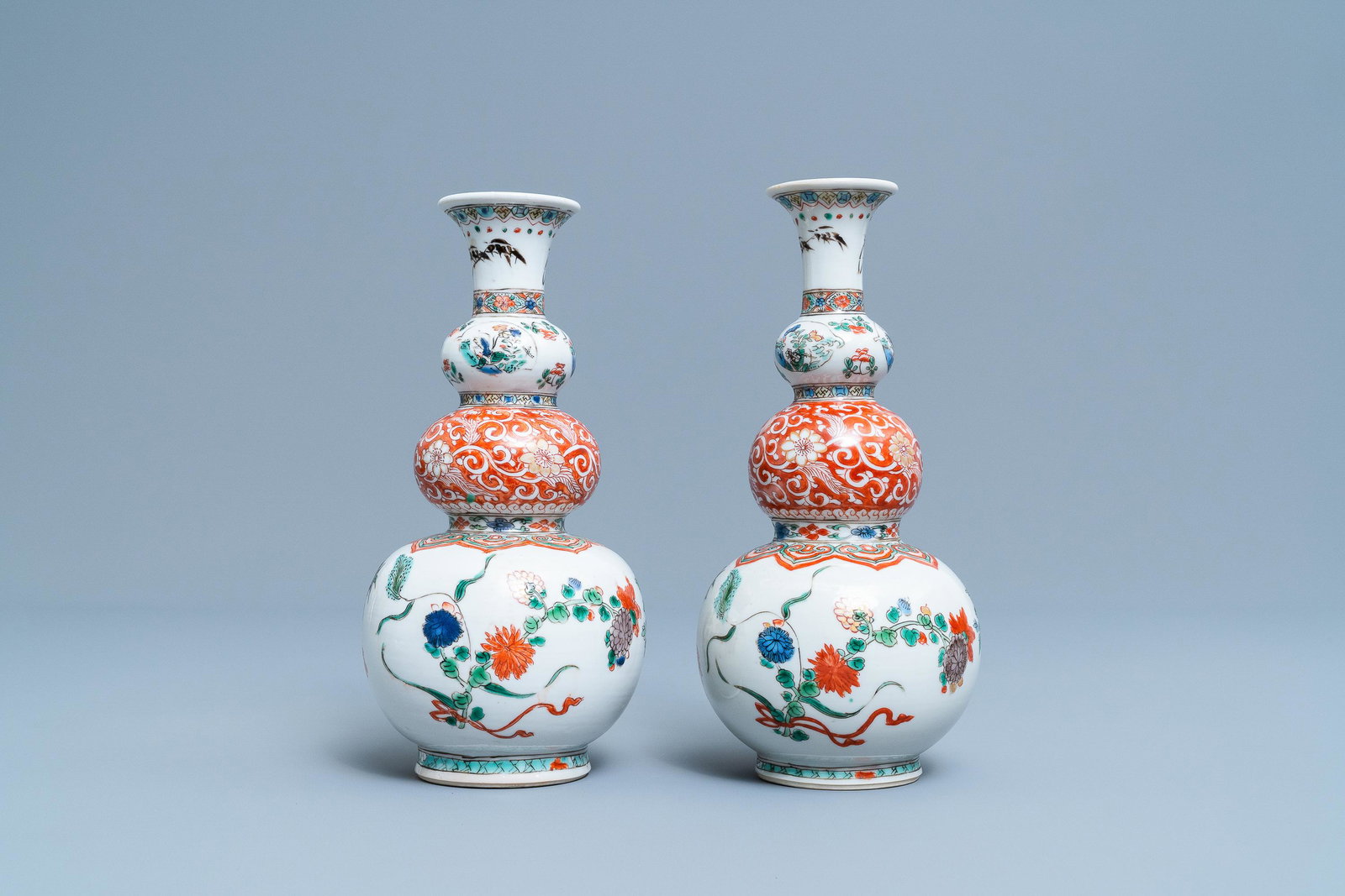 A pair of Chinese famille verte triple gourd vases,: A pair of Chinese famille verte triple gourd vases, Kangxi H.: 22,5 cm