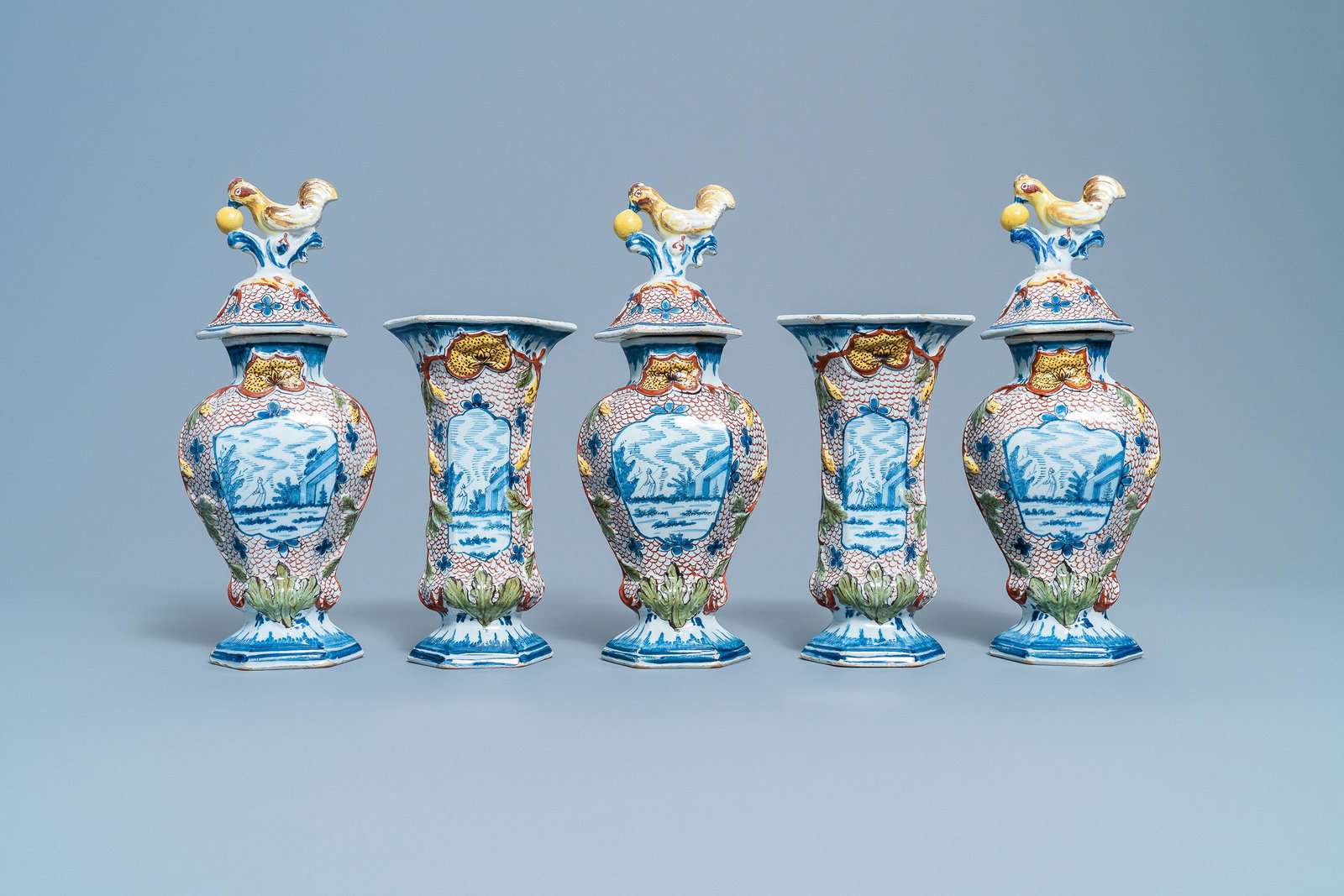 A polychrome Dutch Delft five-piece garniture with: A polychrome Dutch Delft five-piece garniture with chicken-shaped finials, 18th C. H.: 32 cm (the tallest) Each signed on the base with the initials PVMV for Pieter Jansz. van Marksveld, the 'De Griek