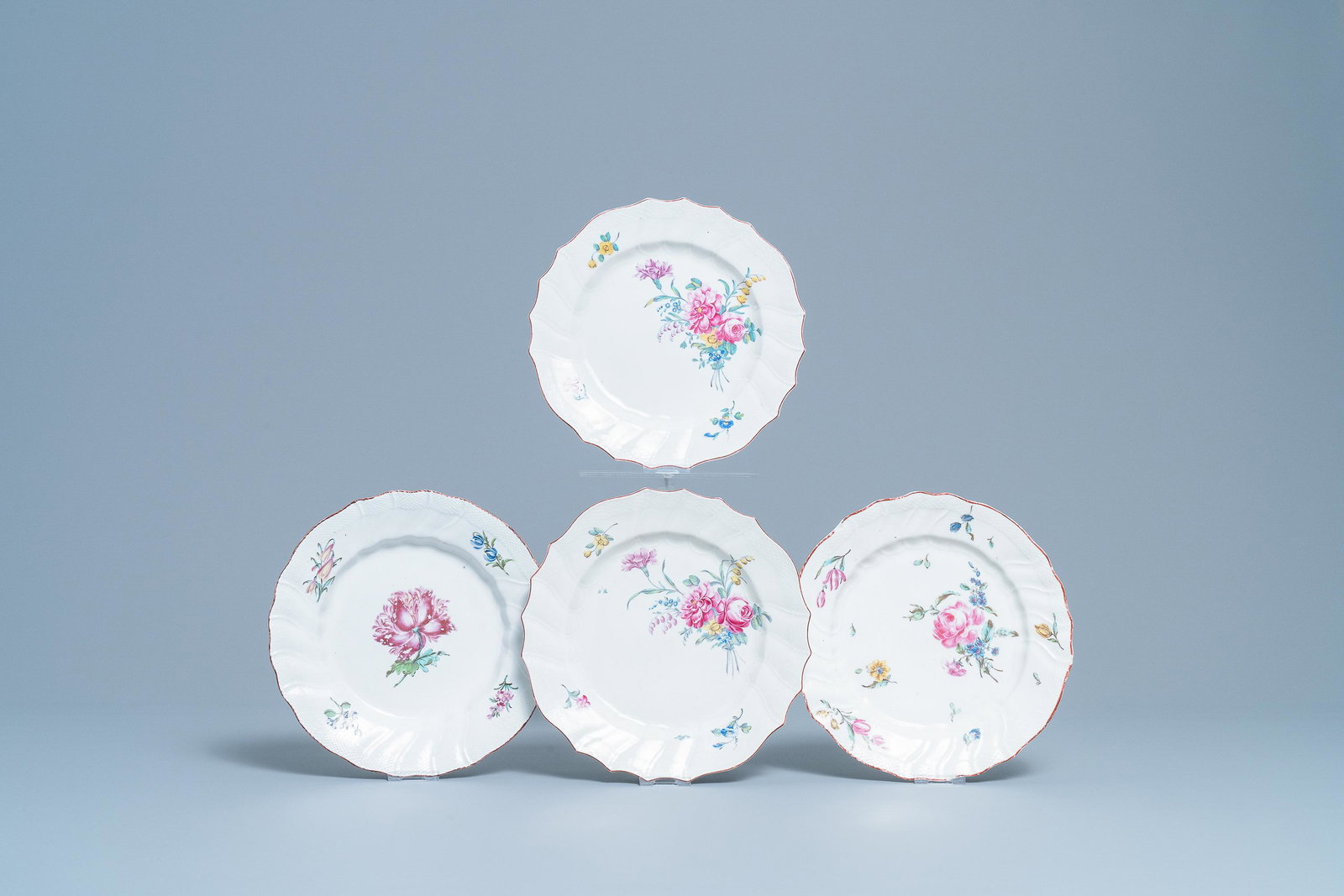 Four polychrome Tournai porcelain plates with flowers,: Four polychrome Tournai porcelain plates with flowers, 18th C. Dia.: 23,5 cm (the largest)