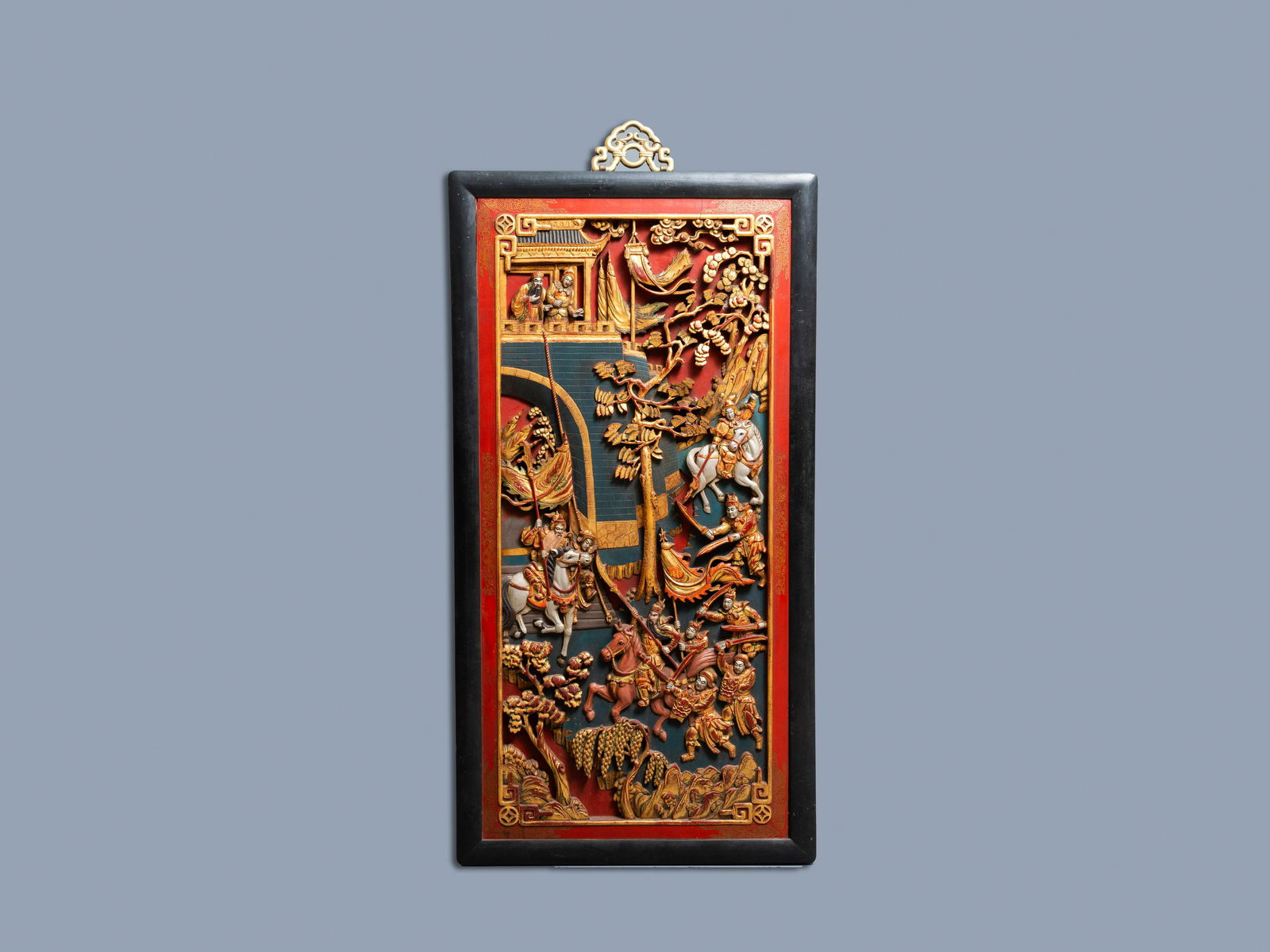 A Chinese lacquered and polychromed carved wooden: Full title: A Chinese lacquered and polychromed carved wooden panel, 19th C. Description: Dim.: 107 x 56,5 cm (the frame)