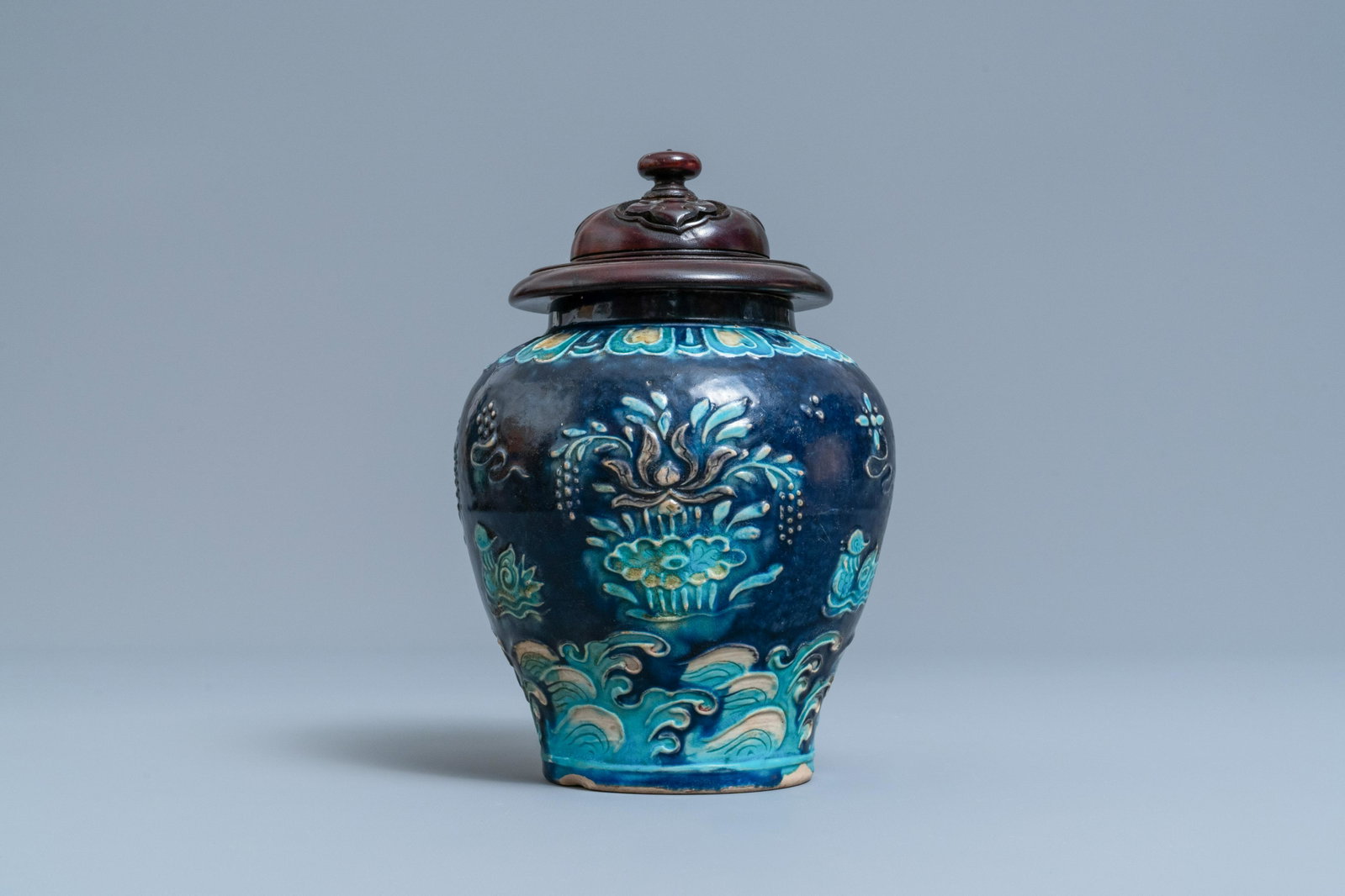 A Chinese fahua vase with mandarin ducks in a lotus: Full title: A Chinese fahua vase with mandarin ducks in a lotus pond, Ming Description: H.: 21,5 cm (incl. cover) H.: 16,5 cm (the vase)