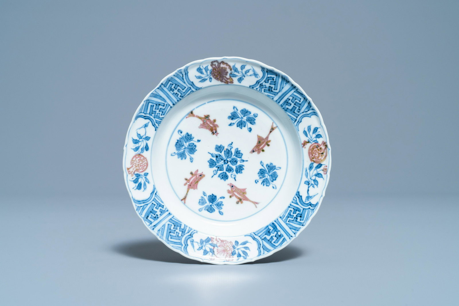 A Chinese blue, white and copper red 'fish' plate,: Full title: A Chinese blue, white and copper red 'fish' plate, Chenghua mark, Kangxi Description: Dia.: 14,5 cm