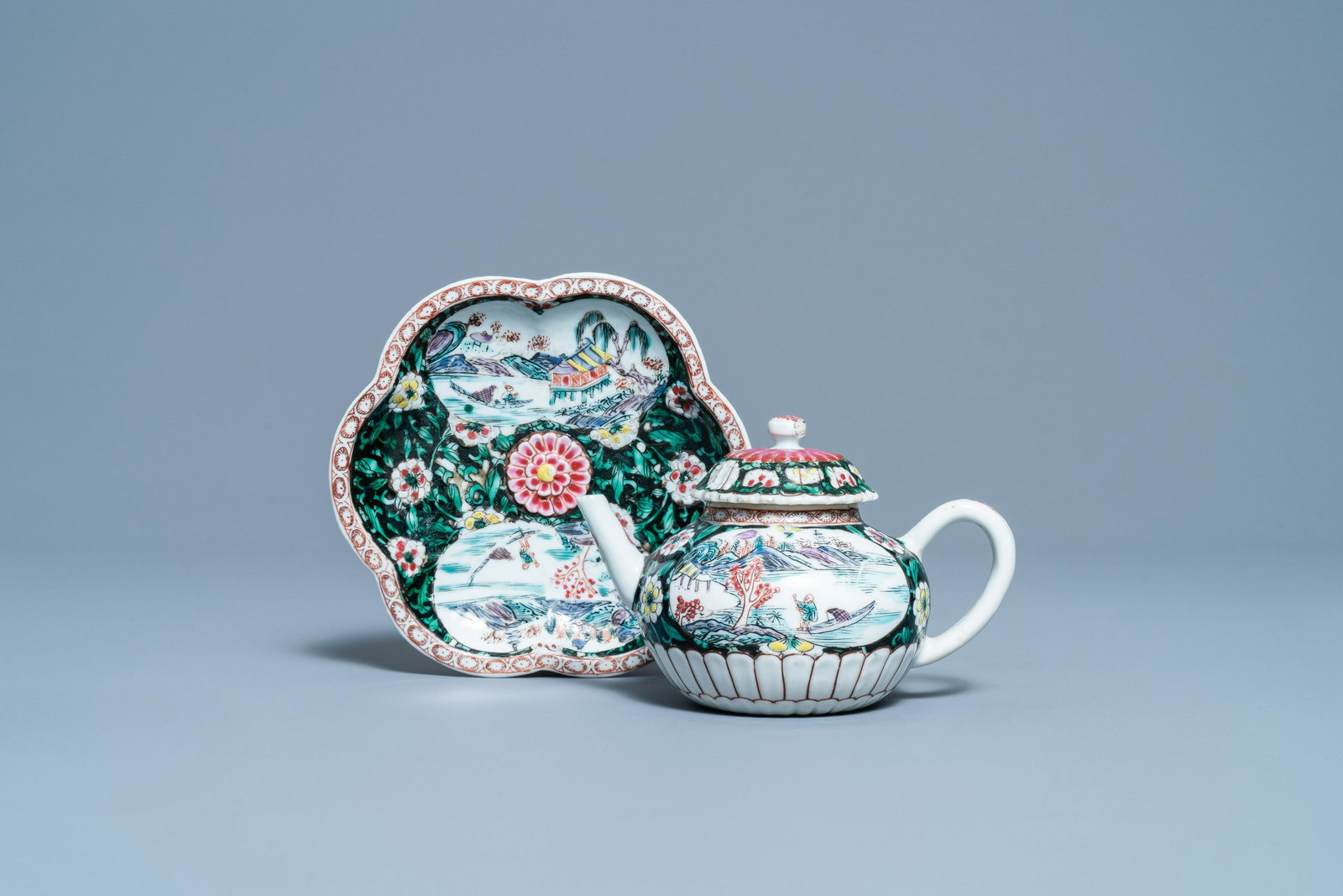 A Chinese famille rose teapot on stand with fishermen: Full title: A Chinese famille rose teapot on stand with fishermen in their boats, Yongzheng Description: Dia.: 15,5 cm (the stand) L.: 15,5 cm - H.: 9,5 cm (the teapot)