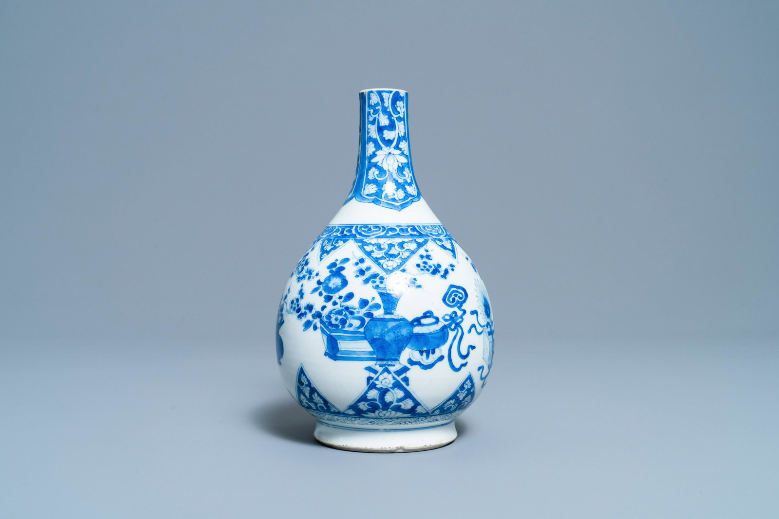 A Chinese blue and white bottle vase, Kangxi: Full title: A Chinese blue and white bottle vase, Kangxi Description: H.: 24 cm
