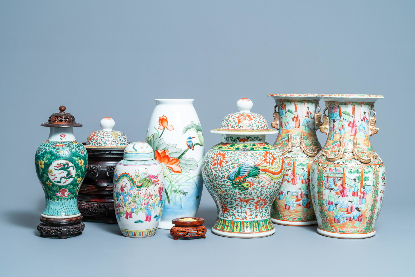 Six Chinese famille rose vases and various wooden: Full title: Six Chinese famille rose vases and various wooden stands and covers, 19/20th C. Description: H.: 36 cm (the tallest vase) Dia.: 28,5 - H.: 11,5 cm (the largest stand)