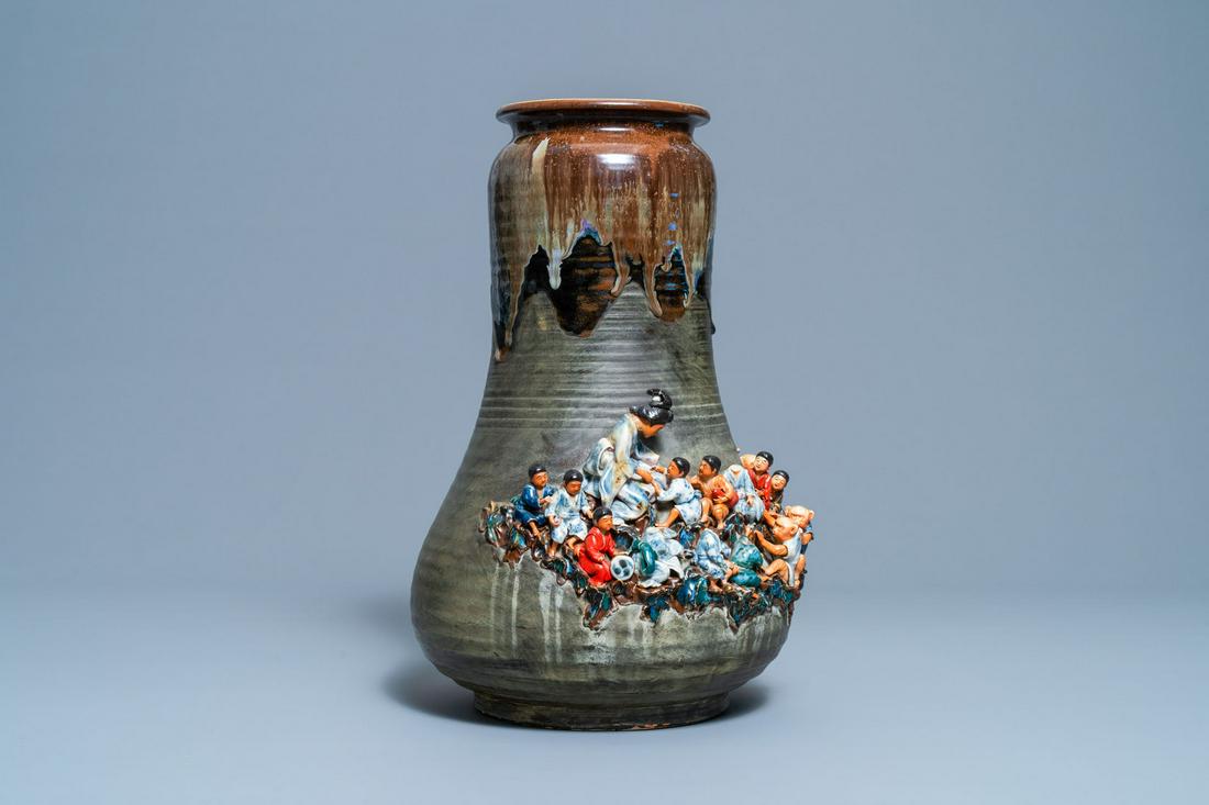 A tall Japanese Sumida Gawa vase with applied design of: Full title: A tall Japanese Sumida Gawa vase with applied design of children and monkeys, Meiji, 19/20th C. Description: H.: 44,5 cm
