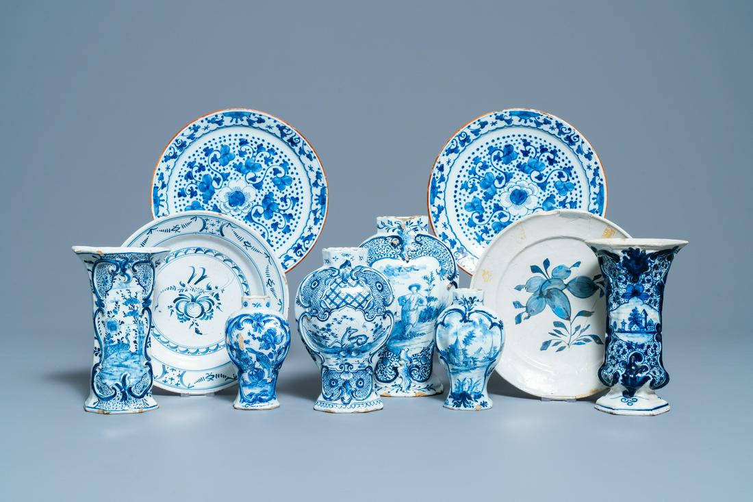 A varied collection of blue and white Dutch Delft: Full title: A varied collection of blue and white Dutch Delft plates and vases, 18th C. Description: Dia.: 23 cm (the largest plate) H.: 22 cm (the tallest vase)