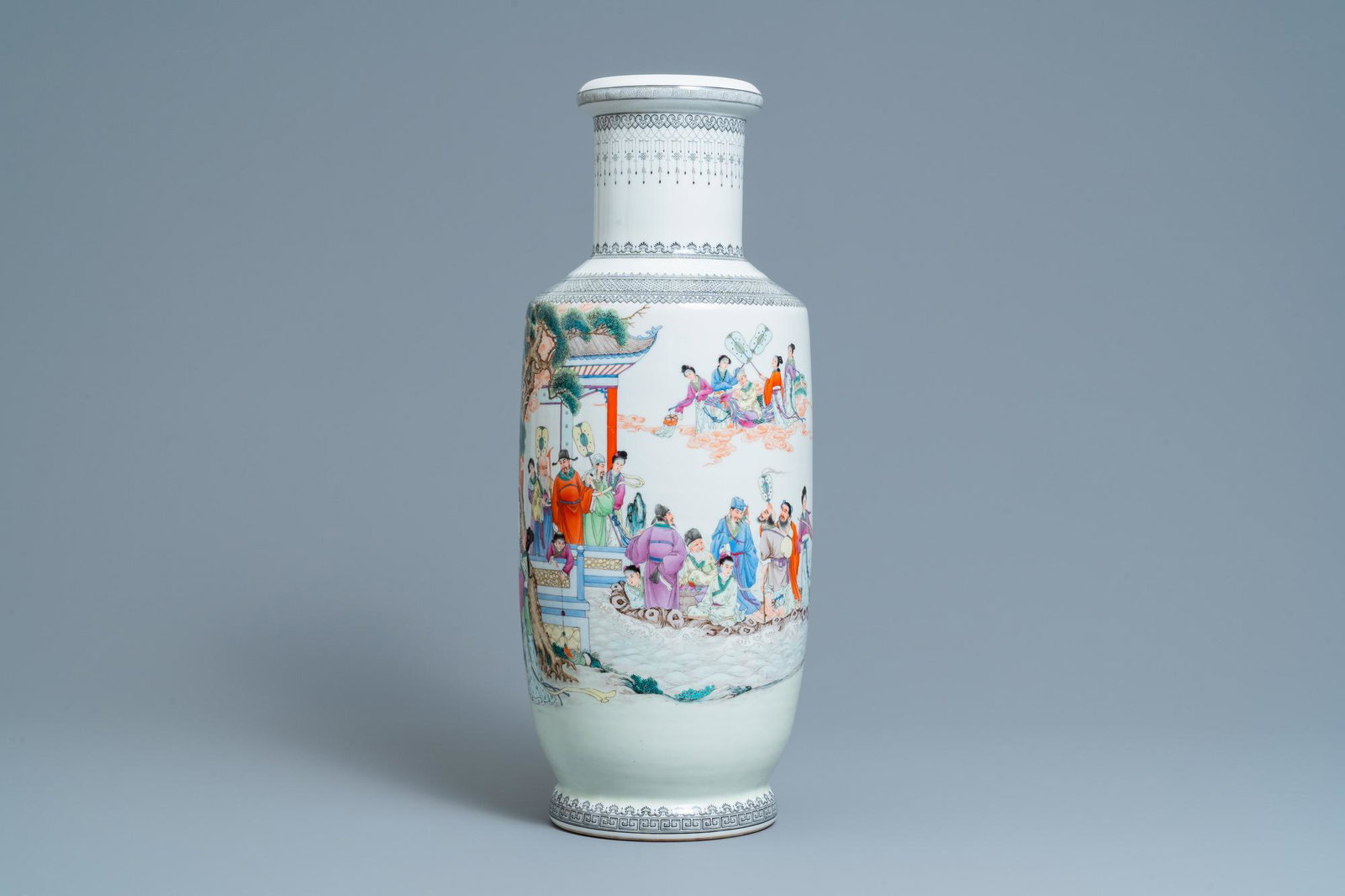 A Chinese famille rose rouleau vase with figures in a: Full title: A Chinese famille rose rouleau vase with figures in a garden, Republic Description: H.: 60,5 cm