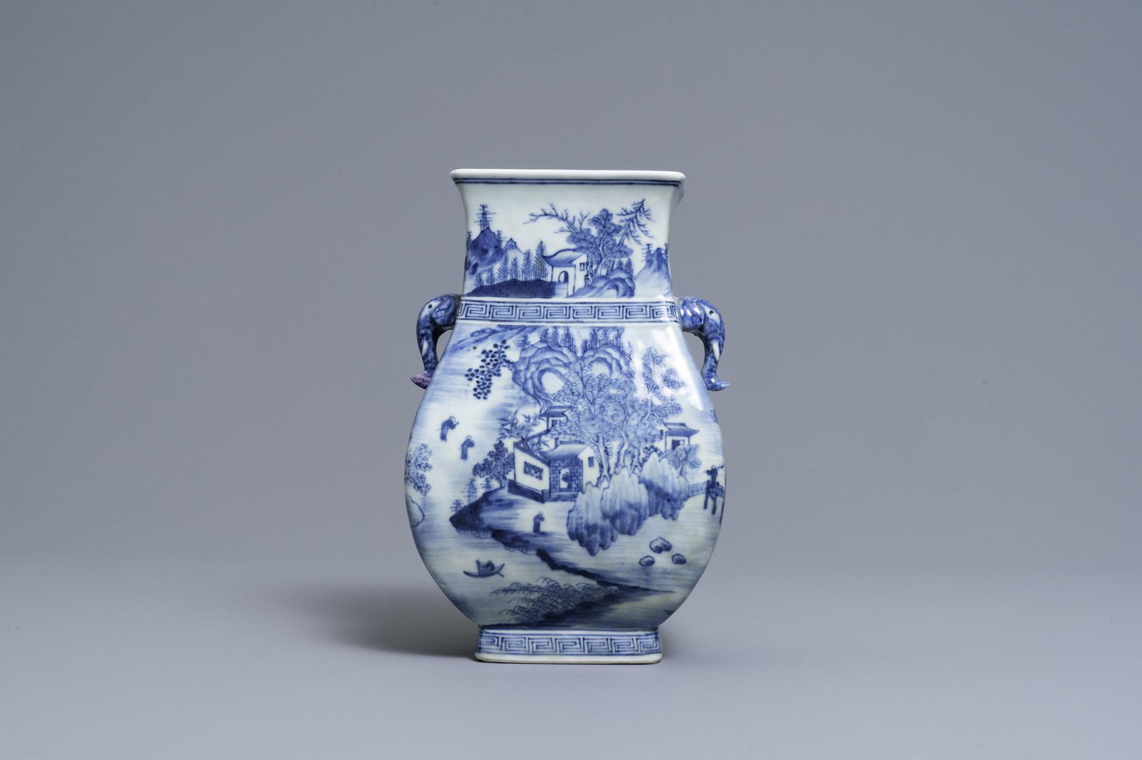 A Chinese blue and white vase with elephant handles,: Full title: A Chinese blue and white vase with elephant handles, Qianlong Description: H.: 25,5 cm