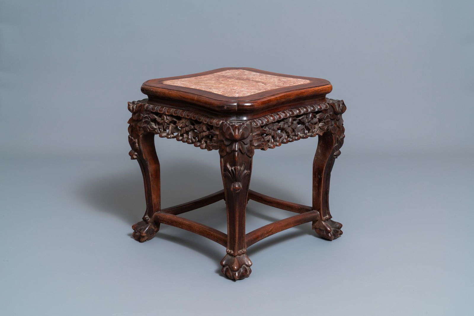 A Chinese carved wooden stand with marble top, 19th C. (1 of 10)
