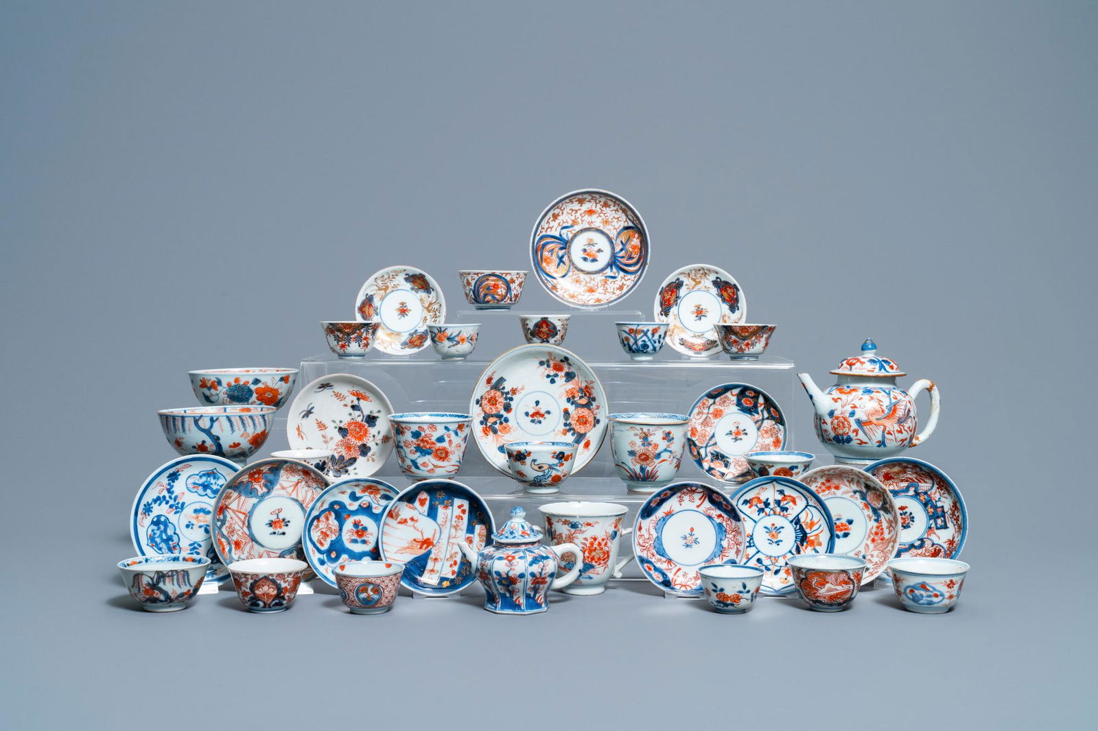 A collection of mostly Chinese blue and white, iron-red: Full title: A collection of mostly Chinese blue and white, iron-red and gilt porcelain tea wares, Kangxi and later Description: L.: 15,5 cm - H.: 12,5 cm (the largest teapot) Dia.: 11,5 cm - H.: 6 cm