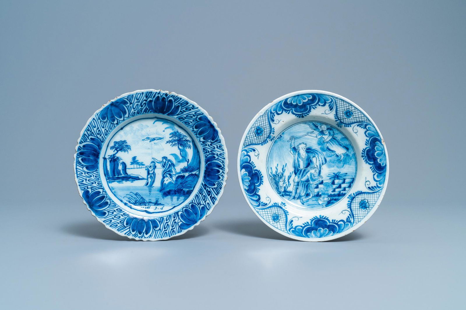Two Dutch Delft blue and white plates with biblical (1 of 2)
