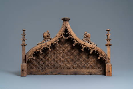 An arch-shaped carved oak baldachin or throne top,: Full title: An arch-shaped carved oak baldachin or throne top, France, 15th C. Description: L.: 72 cm - H.: 47 cm Provenance: - The Davioud-Larminet collection, Lille, France. Expert: