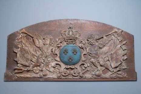 A large polychromed carved oak panel with putti and: Full title: A large polychromed carved oak panel with putti and trophies flanking the royal coat of arms of France, 18th C. Description: L.: 162 cm - H.: 77 cm Provenance: - The Davioud-Larminet