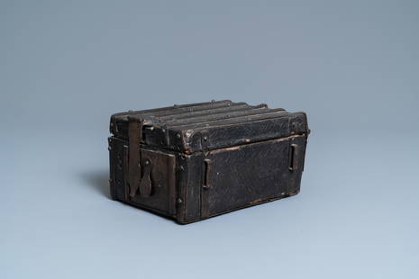 A chiseled leather-clad wooden travel casket, France,: Full title: A chiseled leather-clad wooden travel casket, France, 15th C. Description: Dim.: 22,5 x 18 x 12 cm Provenance: - The Davioud-Larminet collection, Lille, France. Expert: Laurence