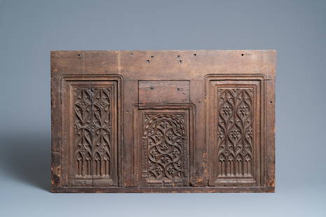 A carved oak front panel of a coffer with tracery: Full title: A carved oak front panel of a coffer with tracery panels, 15th C. Description: Dim.: 86,5 x 55 cm Provenance: - The Davioud-Larminet collection, Lille, France. Expert: Laurence