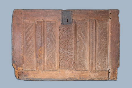 A carved oak front panel of a coffer with tracery: Full title: A carved oak front panel of a coffer with tracery panels and geometrical motives, Brittany, France, 17th C. Description: Dim.: 126,3 x 84 cm Provenance: - The Davioud-Larminet