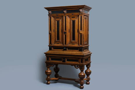 An oak and ebony two-door cabinet, The Low Countries,: Full title: An oak and ebony two-door cabinet, The Low Countries, 17th C. Description: Dim.: 160,5 x 90 x 47 cm Provenance: - The Davioud-Larminet collection, Lille, France. Expert: Laurence