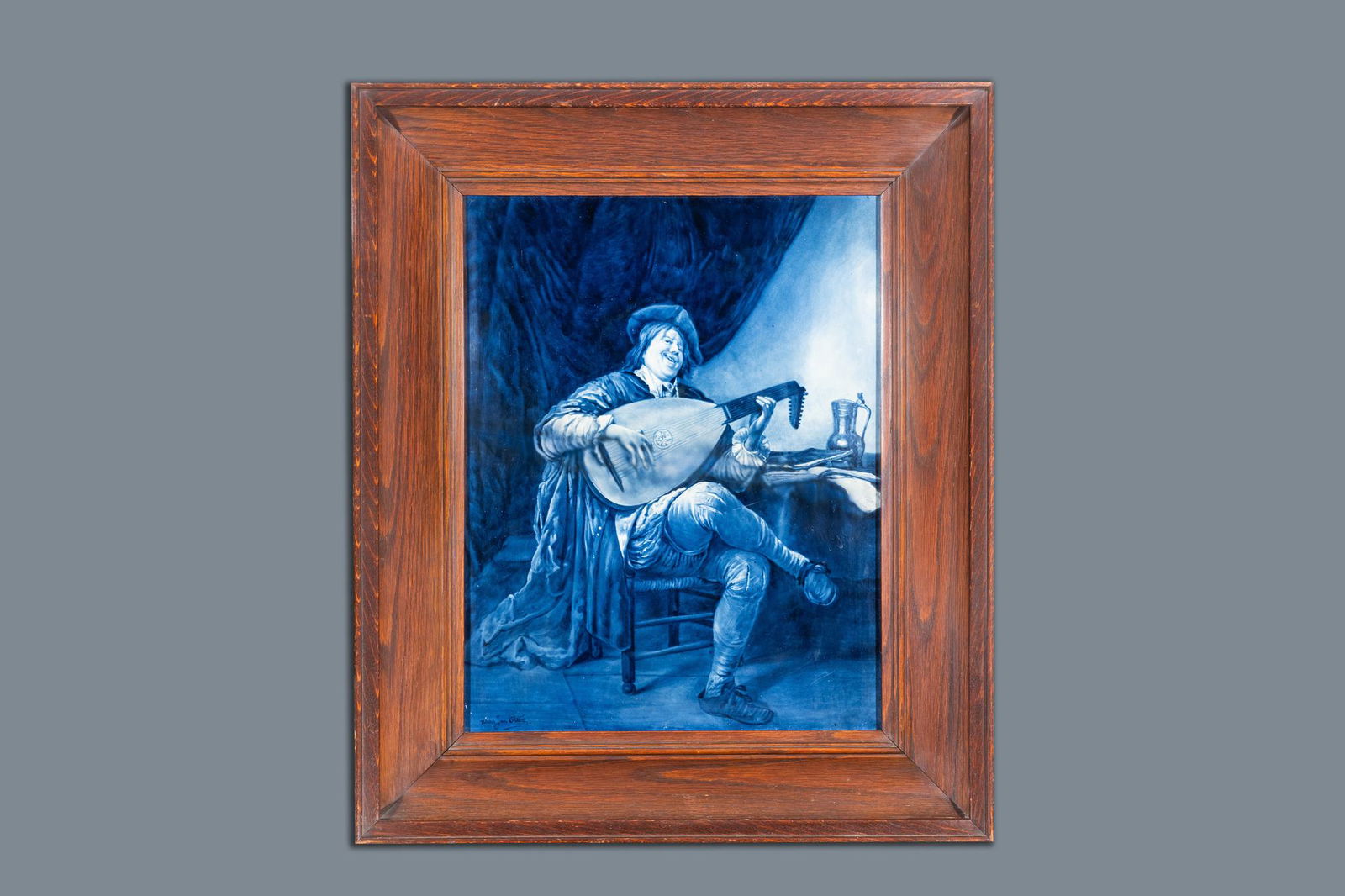 A large Dutch Delft blue and white Porceleyne Fles: Full title: A large Dutch Delft blue and white Porceleyne Fles plaque: 'Self-portrait as a lute player', after Jan Steen, 20th C. Description: Dim.: 69,5 x 58,5 cm (the frame) Dim.: 49,5 x 38,5 cm (th