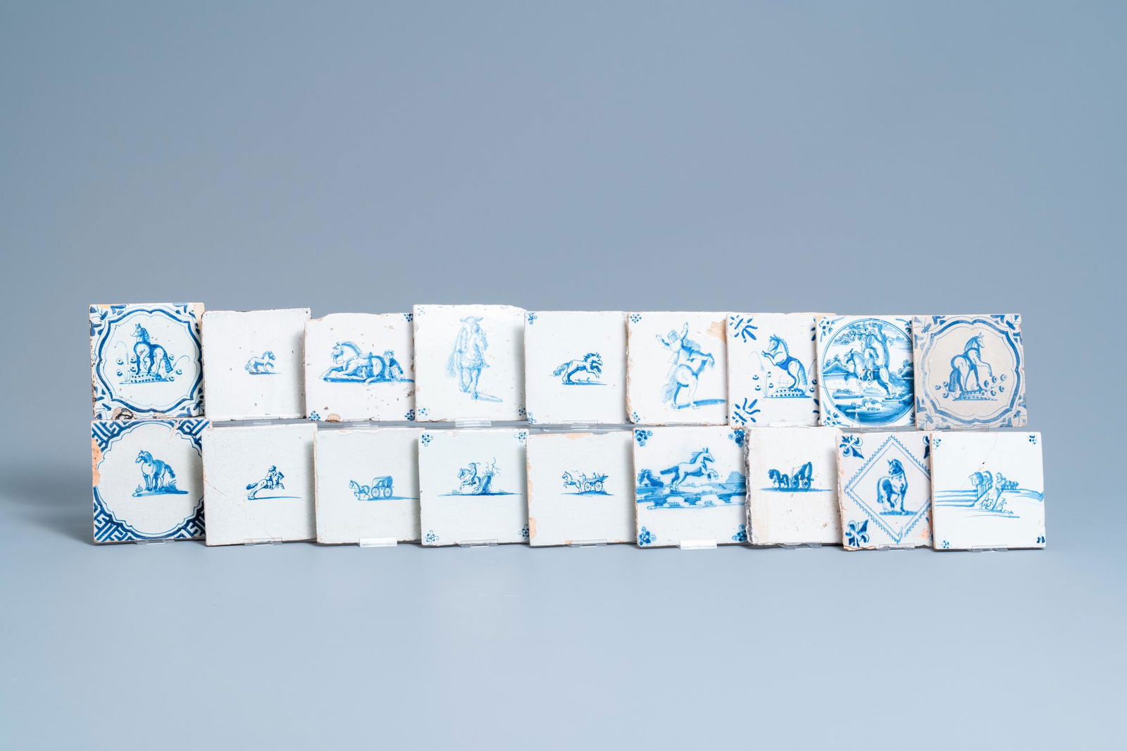 Eighteen Dutch Delft blue and white 'horse' tiles, (1 of 6)