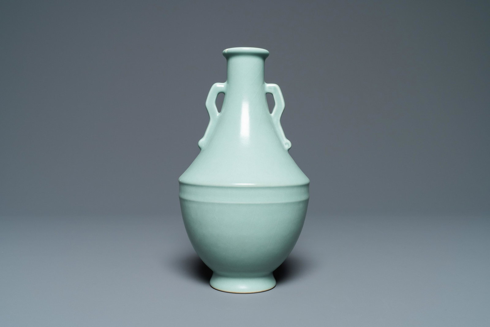 A Chinese monochrome celadon vase, Qianlong mark,: Full title: A Chinese monochrome celadon vase, Qianlong mark, Republic Description: H.: 22 cm The absence of a condition report does not imply that a lot is in perfect condition. Please contact us to 