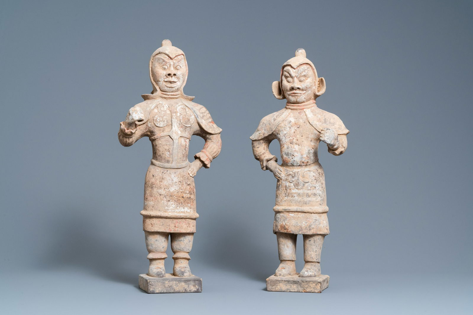 A pair of Chinese painted pottery 'Lokapala' guardian: Full title: A pair of Chinese painted pottery 'Lokapala' guardian figures, Tang Description: H.: 62 cm Provenance: A French private collection. Accompanied by a copy of the certificate of authenticati