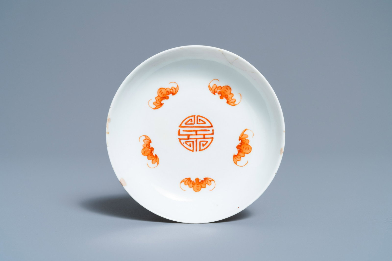 A Chinese famille rose 'bats and Shou' dish, Jiaqing: Full title: A Chinese famille rose 'bats and Shou' dish, Jiaqing mark and of the period Description: Dia.: 10,5 cm The absence of a condition report does not imply that a lot is in perfect condition. 