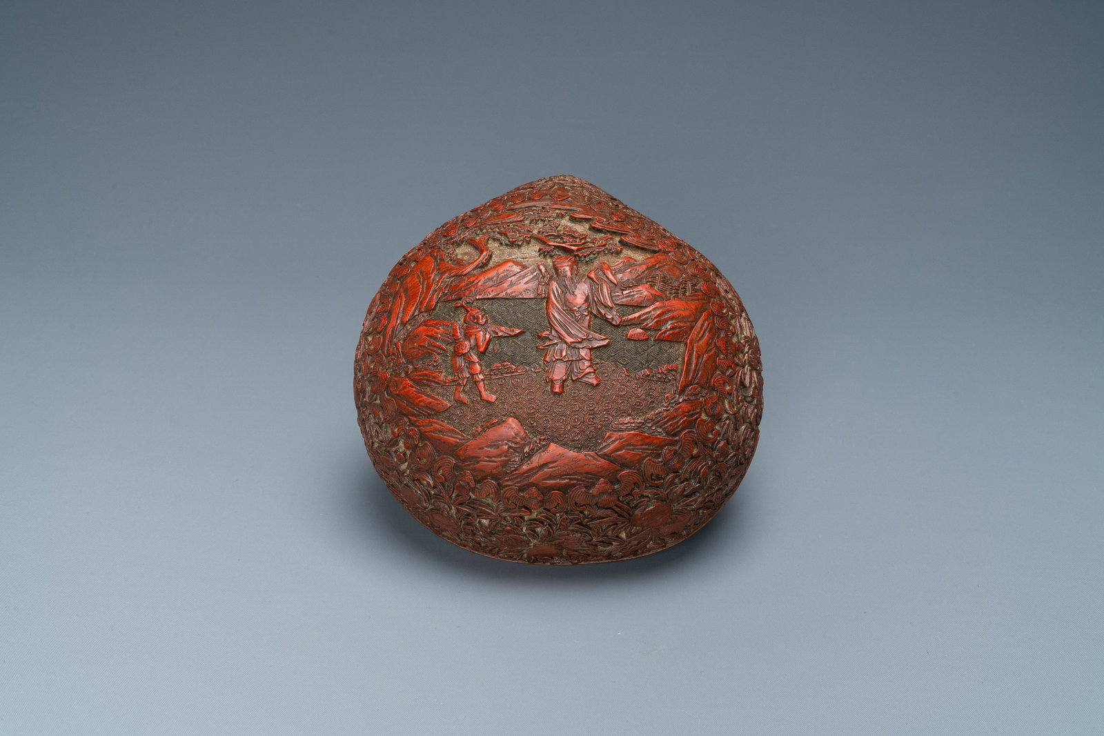 A Chinese red cinnabar lacquer peach-shaped box and (1 of 7)