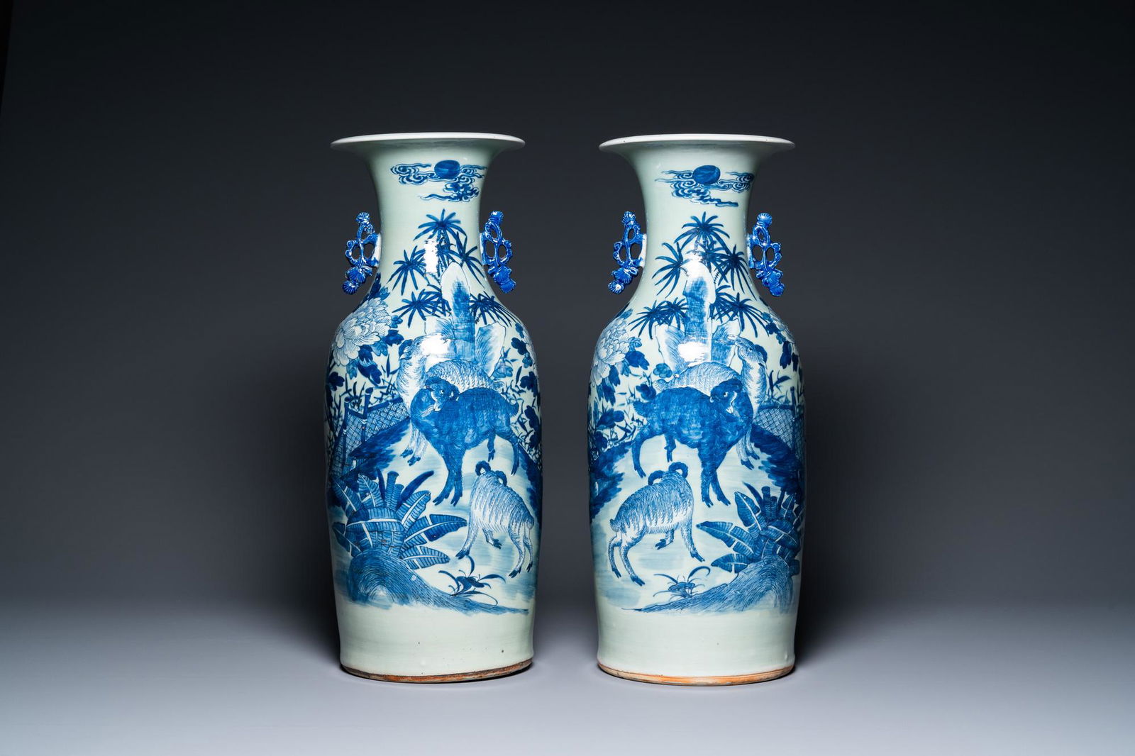 A pair of Chinese blue and white celadon-ground vases with rams, 19th C. (1 of 6)