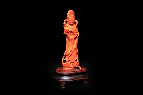 A Chinese carved red coral 'Guanyin' figure, 19/20th C.: Full title: A Chinese carved red coral 'Guanyin' figure, 19/20th C. Description: H.: 19,5 cm (incl. stand) H.: 15 cm (the coral) Weight: 292 grams including the stand The absence of a condition report