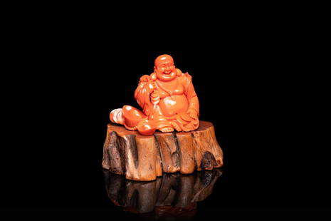 A Chinese carved red coral 'Buddha' figure, Republic: Full title: A Chinese carved red coral 'Buddha' figure, Republic Description: H.: 9,5 cm (incl. stand) H.: 6,5 cm (the coral) Weight: 240 grams including the stand The absence of a condition