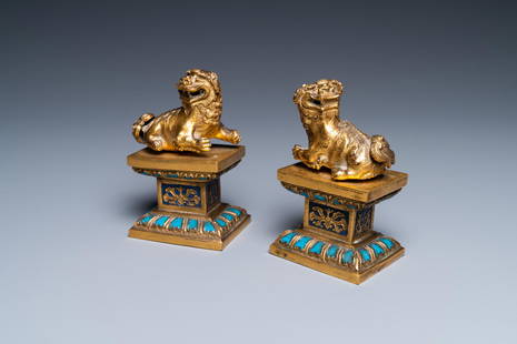 A pair of Chinese gilt bronze Buddhist lions on champleve enamel bases, 18/19th C.: Full title: A pair of Chinese gilt bronze Buddhist lions on champleve enamel bases, 18/19th C. Description: H.: 10,5 cm - L.: 6,5 cm Ref.:- Sotheby's, Paris, Dec. 16, 2010, lot 58, for another