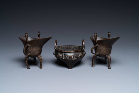 Two Chinese small bronze 'jue' ewers and a tripod censer, probably Yuan: Full title: Two Chinese small bronze 'jue' ewers and a tripod censer, probably Yuan Description: H.: 10 cm (the 'jue' ewers) The absence of a condition report does not imply that a lot is in