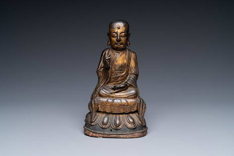 A Chinese gilt bronze figure of Buddha, Ming: Full title: A Chinese gilt bronze figure of Buddha, Ming Description: H.: 26 cm The absence of a condition report does not imply that a lot is in perfect condition. Please contact us to let us