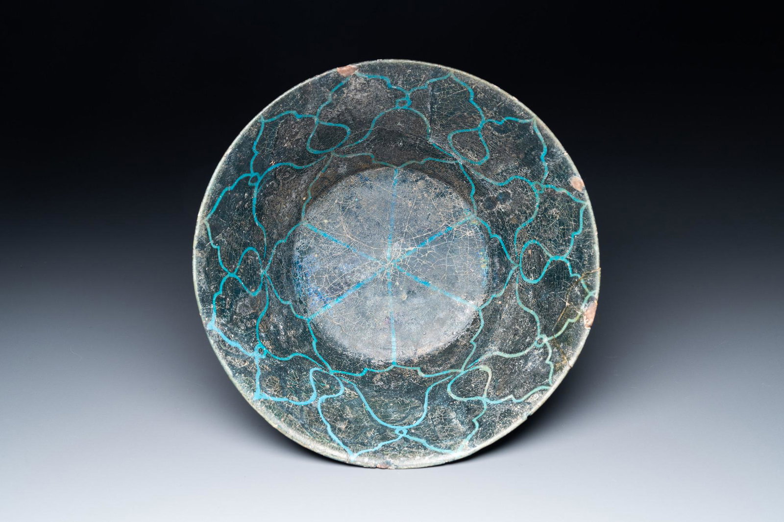 A turquoise- and black-glazed bowl, Kashan, Iran, 12/13th C. (1 of 7)