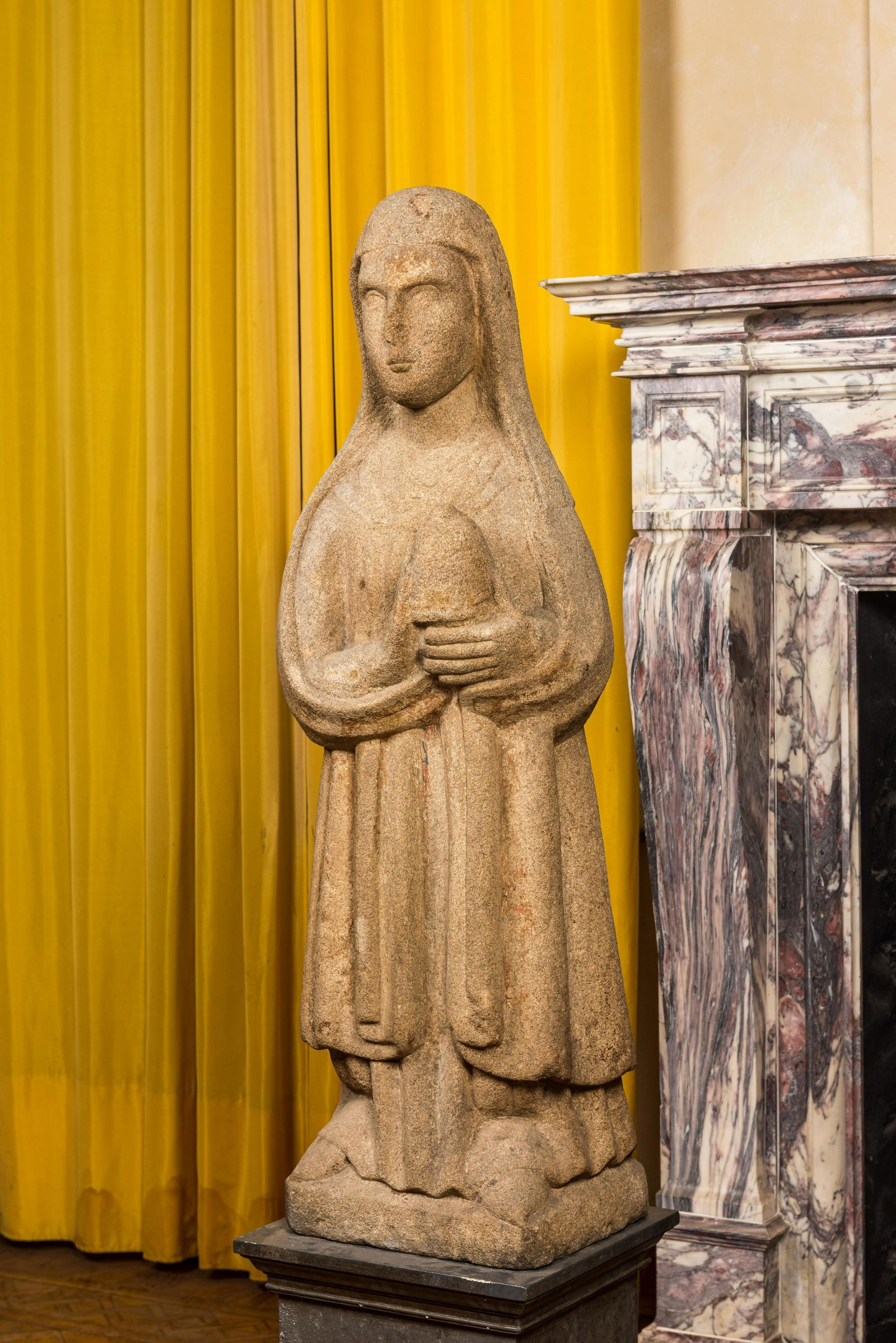 A large French granite sculpture of one of the holy female myrrhbearers, Brittany, 16th C. (1 of 3)