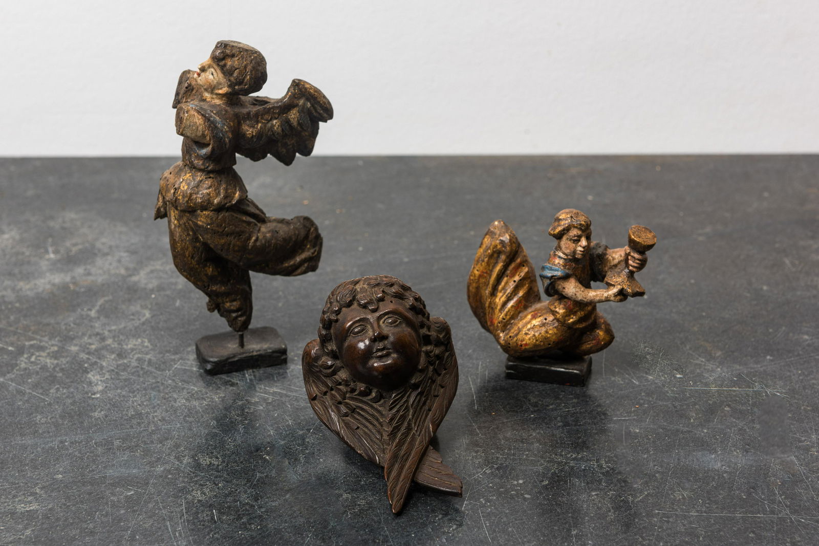 Three small wooden sculptures of putti, 16/17th C. (1 of 2)