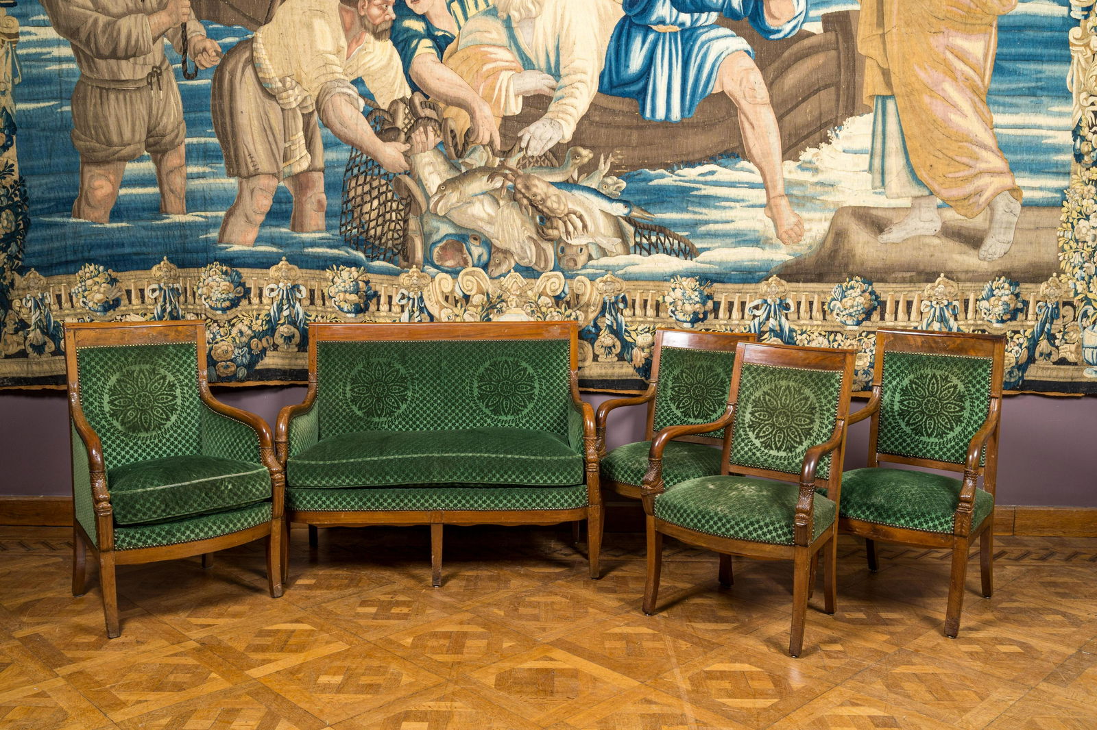 A green-upholstered carved wooden salon set with a two-seater, a fauteuil and three armchairs, 19th (1 of 5)