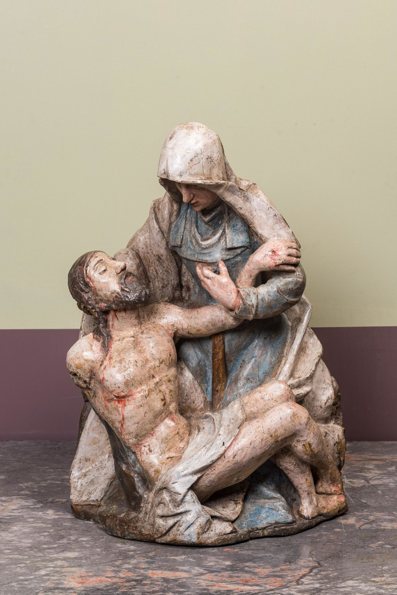 A polychromed walnut PietÃ , Spain or Southern Italy, early 17th C. (1 of 3)