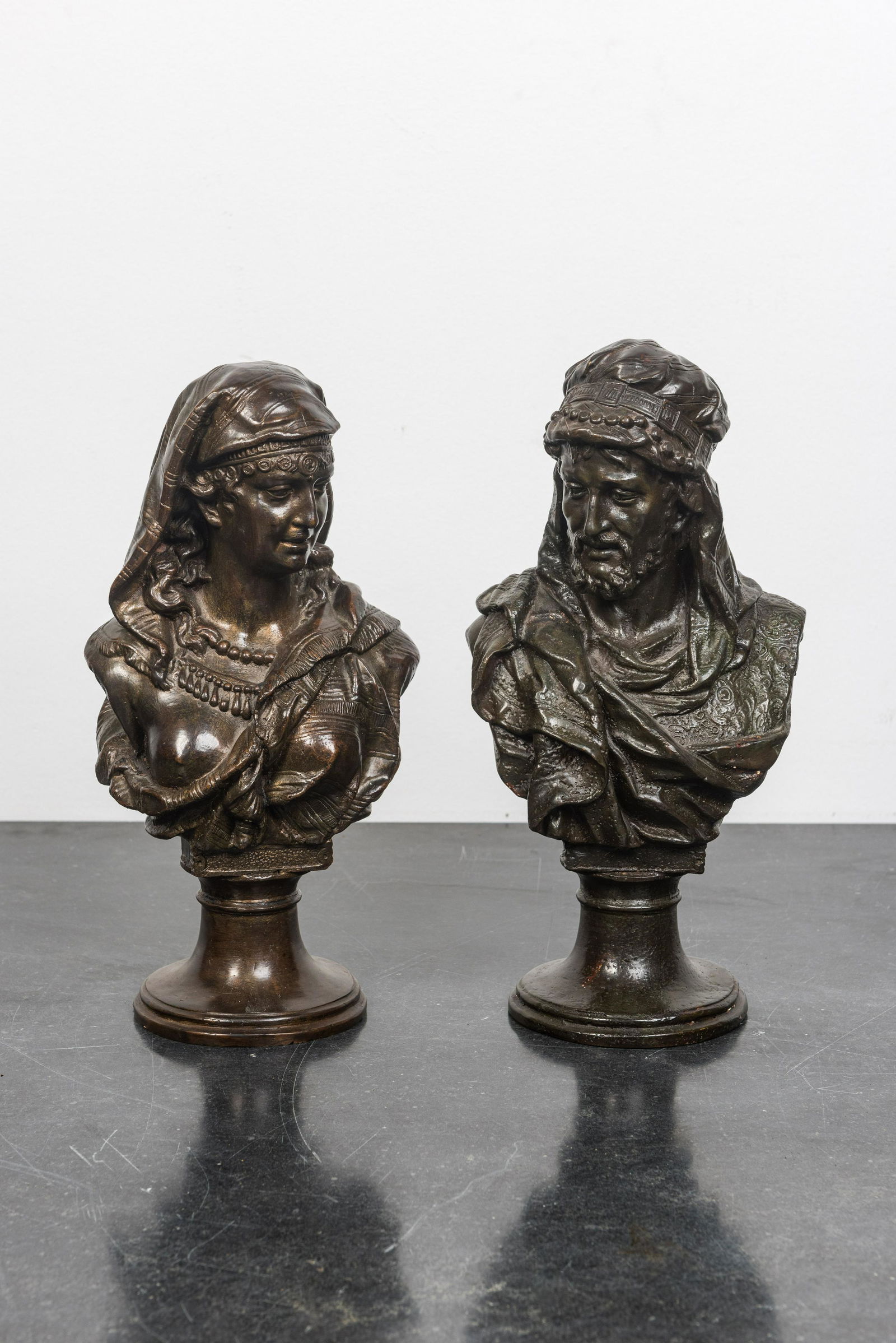 A pair of patinated bronze oriental subject busts, 19th C. (1 of 2)