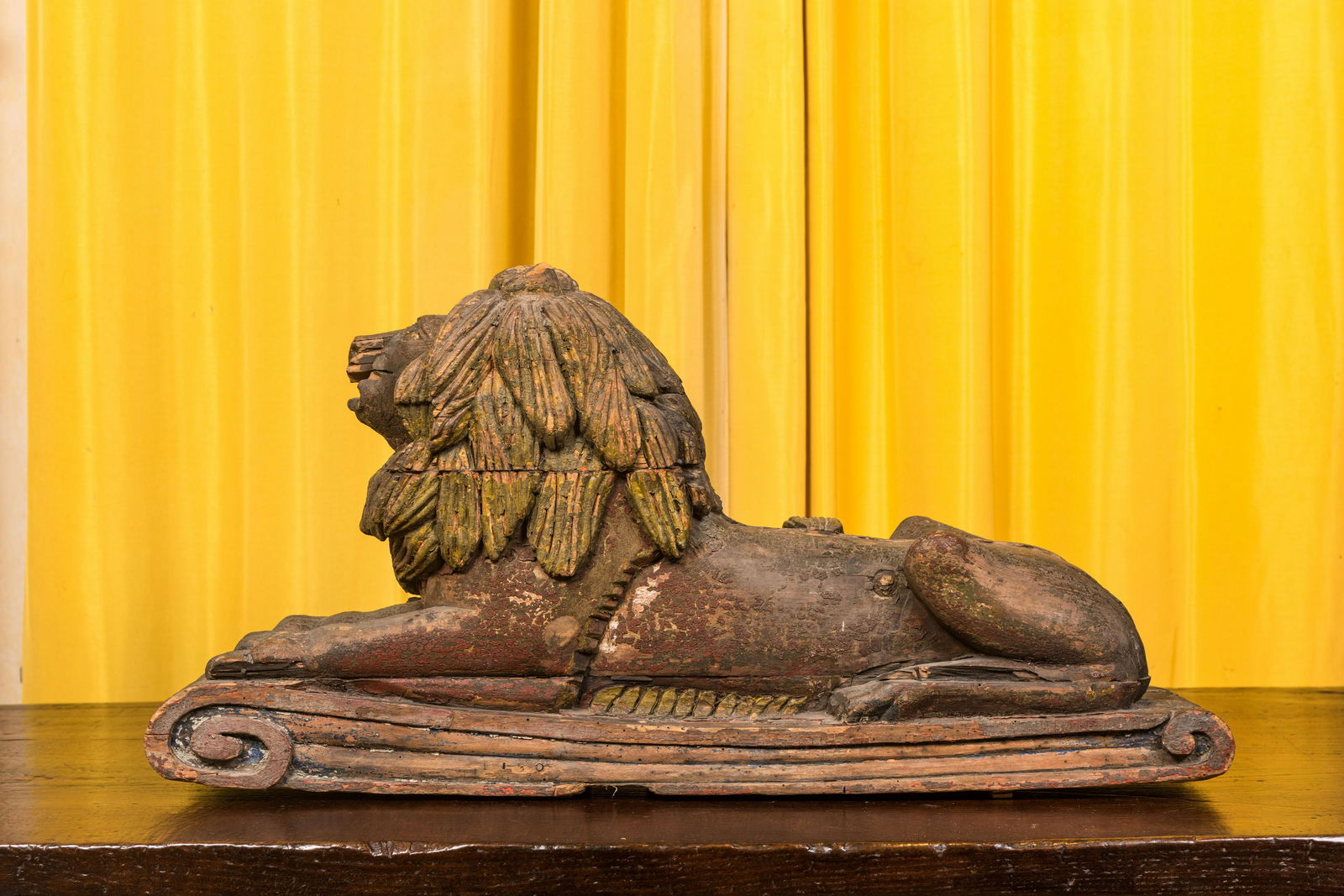 A painted wooden model of a recumbent lion, 19th C. (1 of 3)