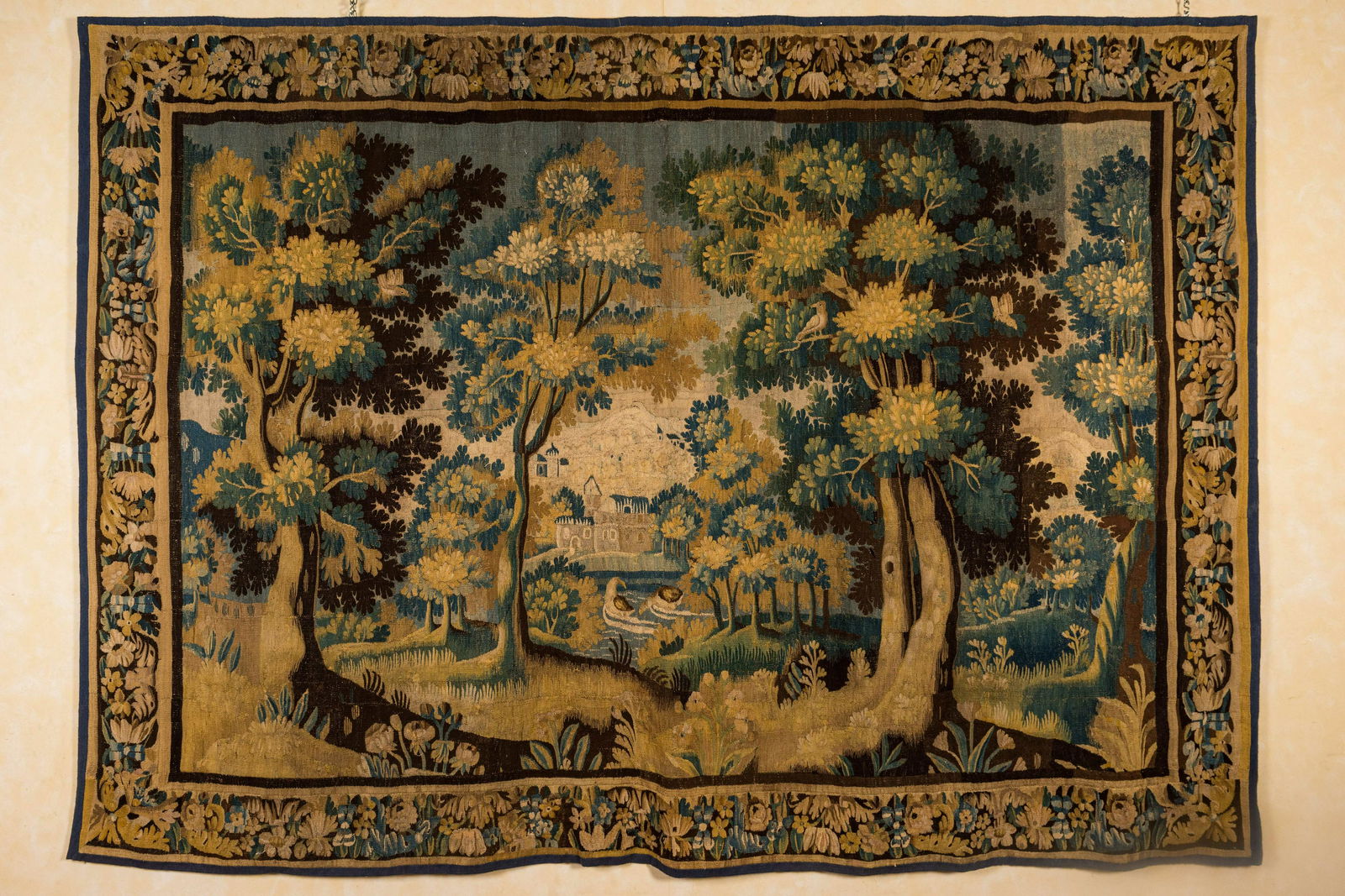 A Flemish wall tapestry with a forest view with a castle, 17th C. (1 of 3)